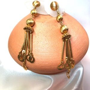 Dangling gold tone clip earrings
